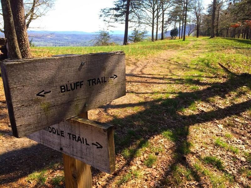 Bluff trail sign overlooking the valley