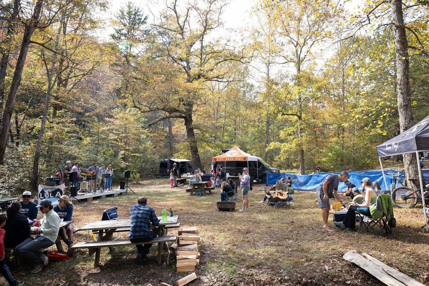Picnic tables and tents at the race village